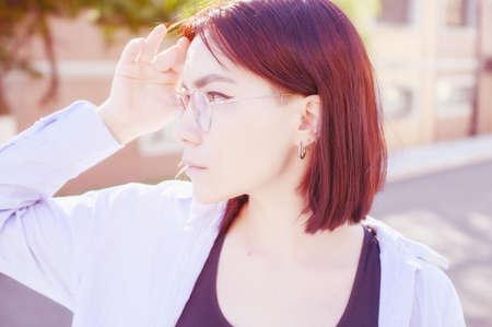 Portrait of beautiful redhead woman wearing glasses.の写真素材