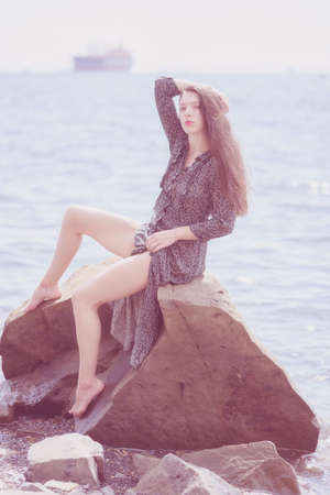 Beautiful adult woman enjoy the sea on a sunny day.の写真素材