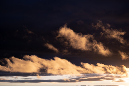 Sunset sky with orange clouds. nature background.の写真素材