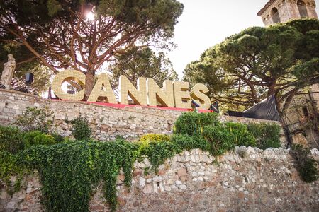 CANNES, FRANCE â MAY 21, 2017: The famous landmark sign of Cannes written in light bulbs in the heights of le Suquet.のeditorial素材