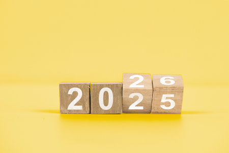 Wooden blocks arranged to show the year 2025, symbolizing the upcoming year and new beginnings, set...