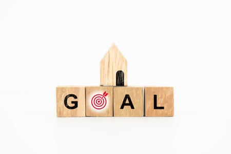 Goal Achievement with House Target on Wooden Blocks