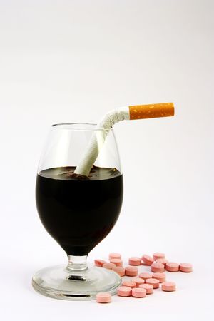 Glass of alcohol, drugs and cigarettesの写真素材