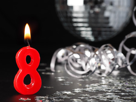 Red candles showing Nr. 8.  Abstract Background for birthday or anniversary party.の写真素材