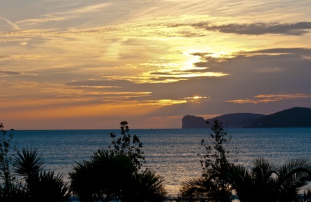 the most romantic sunsets are on the sea, alghero, sardinia, italyの写真素材