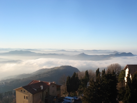 The mountains in fog looks like the islands in the seaの写真素材