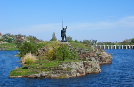 Huge knight standing on the island and protecting the cityの写真素材
