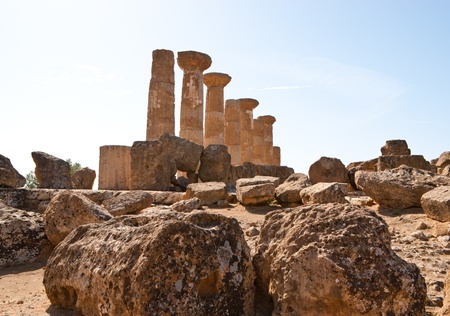 Some columns and scattered stones that's all that remains from the temple of Heracles in Agrigento, Sicily, Italyの写真素材