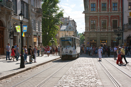 The tram rides on the Market Square during the city fair, Lviv, Ukraine.のeditorial素材