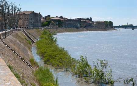 The left bank of Rhone river with the medieval houses, Arles, Franceの写真素材