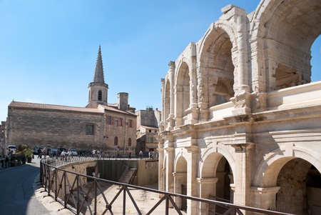 In ancient Arles the landmarks of roman period and medieval buildings are neighbours.の写真素材