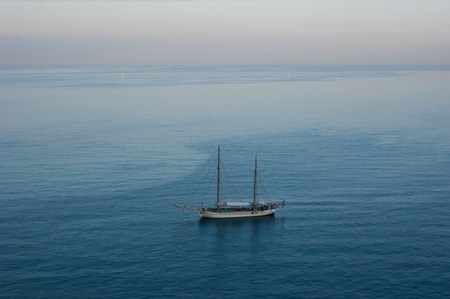 The lonely yacht in waters of the Gulf of Naples near Sorrento.の写真素材