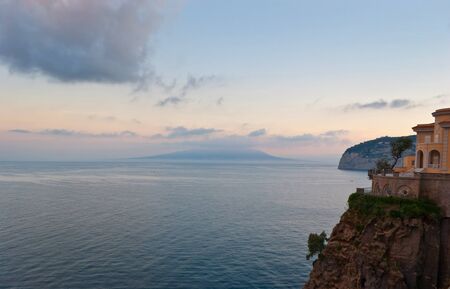 The Vesuvius mount is sleeping in the early morning covered by cloudsの写真素材