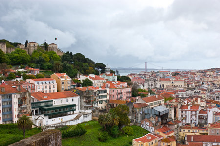 The view on city of Lisbon, 25th of April Bridge across Tagus river, St  George Castle, Portugal のeditorial素材