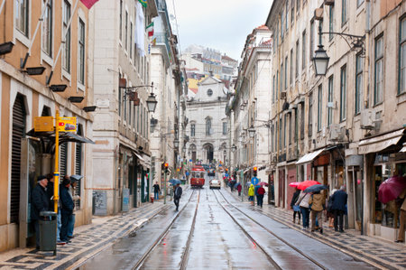 Lisbon, Portugal - May 2, 2012 - The Lisbon cityscape with red tram on Rua Vitor Cordon during the...