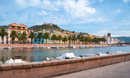 Walking on promenade in Bosa you can enjoy the view on the old town, Serravalle's Castle and Temo river, Sardinia, Italy.のeditorial素材