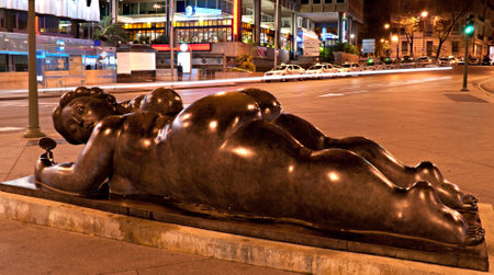 MADRID, SPAIN - APRIL 27, 2012: ThE sculpture of colombian figurative artist fernando botero depicts young woman with a small mirror, on April 27 in Madridのeditorial素材
