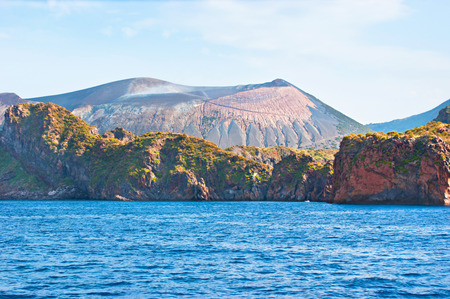The smoking Fossa cone with the old  traces of eruption on its slope, Vulcano Island, Italy.の写真素材