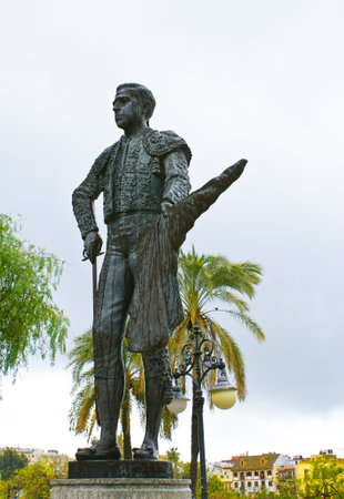 SEVILLE, SPAIN - MAY 3, 2013:  The bronzed statue of Pepe Luis Vazques was placed in front of the Plaza de Toros of the Real Maestranza, on May 3 in Seville.のeditorial素材