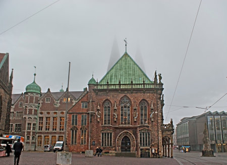 BREMEN, GERMANY - NOVEMBER 21, 2012: The spires of St Peter's Cathedral are hardly visible in fog, behind the Town Hall, on November 21 in Bremen.のeditorial素材