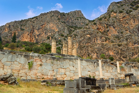 The ruins of ancient temple of Apollo with Parnassus mountains on the background, Delphi, Greece.