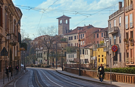 PADUA, ITALY - FEBRUARY 24, 2012: Riviera Ruzante is one of the main streets of the medieval city with old church tower on the background, on February 24 in Padua.のeditorial素材