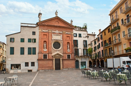 PADUA, ITALY - APRIL 23, 2012: The Church of St. Clement I Pope located on Piazza di Signori, the perfect place to relax in cafe or to make some shopping, on April 23 in Padua.のeditorial素材