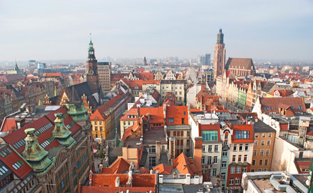 WROCLAW, POLAND - NOVEMBER 24, 2012: The high bell tower of St Mary Magdalene Church is the best place to enjoy the view on the Town Hall and  the colorful city roofs, on November 24 in Wroclaw.のeditorial素材