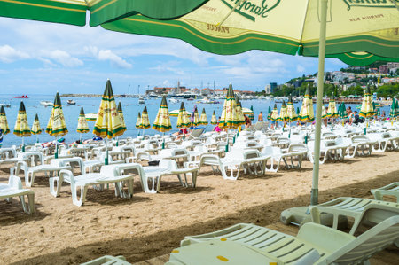 BUDVA, MONTENEGRO - JULY 12, 2014: The scenic beach located next to the old town with well preserved citadel, on July 12 in Budvaのeditorial素材