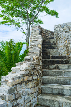 The narrow winding staircase leads to the top of the fortress wall, it's the best place to see the old town, Budva, Montenegro.のeditorial素材