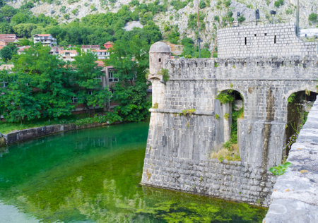 The huge ramparts of the old Venetian citadel  surrounded by moat, Kotor, Montenegro.のeditorial素材