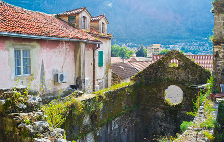 The ruins located next to the residential buildings in the old town of Kotor, Montenegro.の写真素材