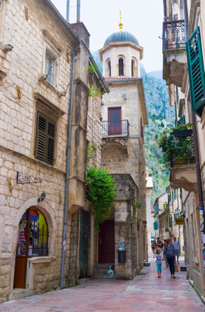 KOTOR, MONTENEGRO - JULY 12, 2014: The old town is full of narrow medieval streets with the souvenir shops, tiny cafes, sport bars and different landmarks, on July 12 in Kotor.のeditorial素材