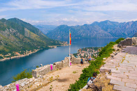 KOTOR, MONTENEGRO - JULY 15, 2014: The viewpoint located in the St John fortress is the best choise to enjoy the aerial view on the old town, Kotor bay with the sailing yachts, on July 15 in Kotor.のeditorial素材