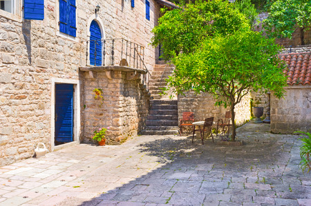 The scenic yard surrounded by the old stone buildings of the Praskvica Monastery, Celobrdo, Montenegro.の写真素材