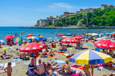 ULCINJ, MONTENEGRO - JULY 14, 2014: The perfect sand beach boasts the view on the old citadel Kalaja, on July 14 in Ulcinj.のeditorial素材