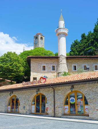 ULCINJ, MONTENEGRO - JULY 14, 2014: The tourist street with the old stone mosque on the background, on July 14 in Ulcinj.のeditorial素材