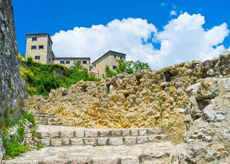 The narrow staircase leads to the Kalaja fortress with many cafes and restaurants for the tourists pleasure, Ulcinj, Montenegro.の写真素材