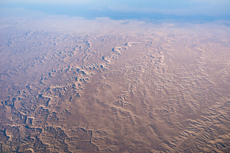 The Egypt desert from the air, with the Nile river on the background.の写真素材