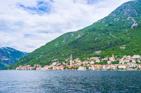 The cloudy sky over the old town of Perast, Montenegro.の写真素材