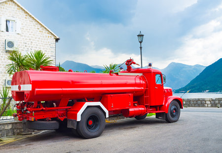 The retro fire truck parked on the promenade of Perast, Montenegro.