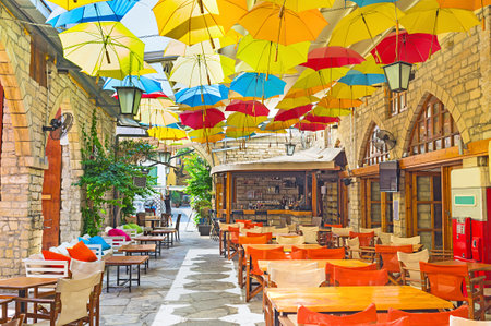 The weather doesn't matter, if you are under umbrella in the cozy cafe, Limassol, Cyprus.のeditorial素材