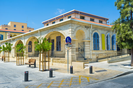 The building of the old Court House located next to the tourist neighborhood of the city, Limassol, Cyprus.のeditorial素材