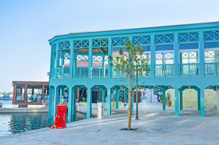 The seaside cafe in Limassol Marina boasts the comfortable wooden terrace with a great view, Cyprus.のeditorial素材