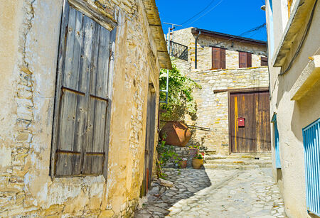 The mountain village is reach in the tiny medieval streets, narrow yards, old stone climbs and descents, Lefkara, Cyprus.の写真素材
