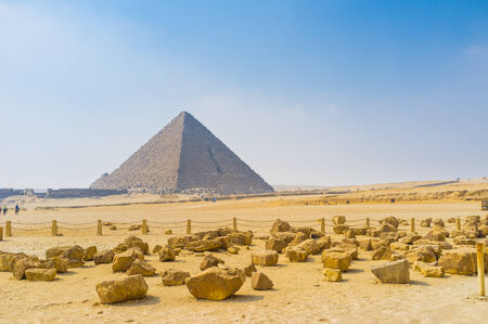 The Pyramid of Menkaure with the large yellow stones on the foreground, Giza, Egypt.の写真素材
