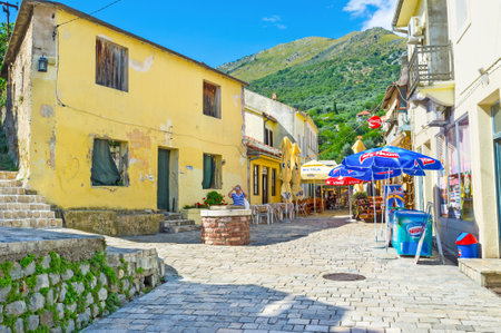 STARI BAR, MONTENEGRO - JULY 14, 2014: The hilly tourist street is full of cafes, restaurants and souvenir shops, located in the old houses, on July 14 in Stari Bar.のeditorial素材
