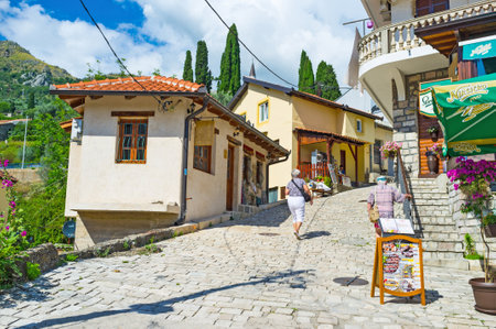 STARI BAR, MONTENEGRO - JULY 14, 2014: The hilly street with the cafes and souvenir shops leads to the old fortress, on July 14 in Stari Bar.のeditorial素材