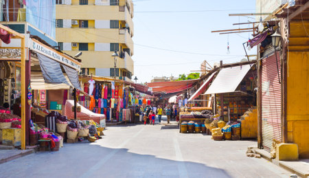 ASWAN, EGYPT - OCTOBER 6, 2014: The owners of stalls selling a mixture of spices, clothing and tourist souvenirs, on October 6 in Aswan.のeditorial素材