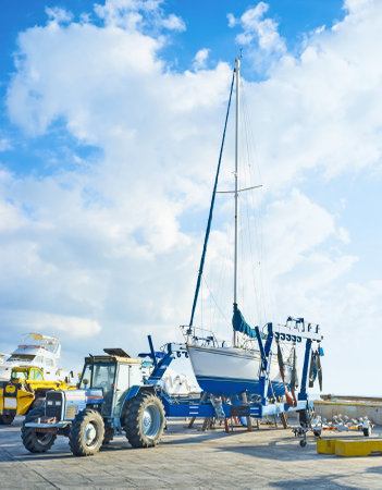 The yacht stands on the boat trailer in port of Latchi, Cyprus.のeditorial素材
